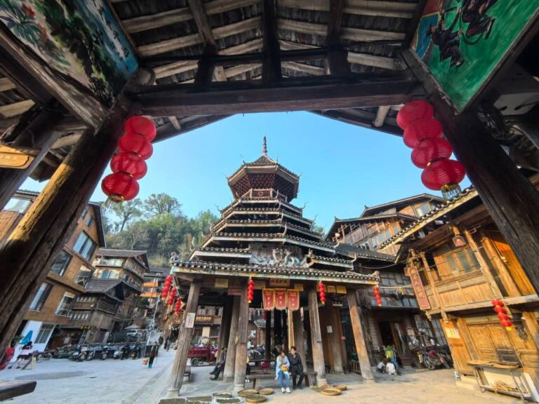 A glimpse of Xijiang Thousand Household Miao Village, showcasing its traditional wooden stilt architecture and vibrant cultural charm