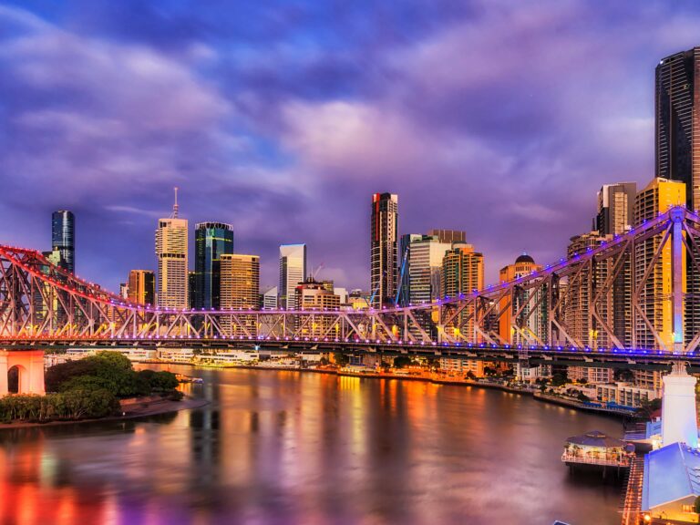 Story Bridge illuminated in Brisbane at dusk.