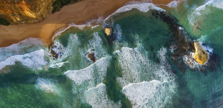 Aerial view of the Twelve Apostles rock formations along the coast.