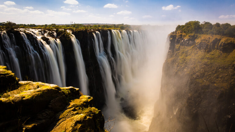 Victoria Falls waterfall with mist and cliffs