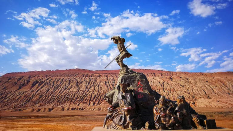 Statues of Journey to the West characters in front of the Flaming Mountains in Turpan, Xinjiang