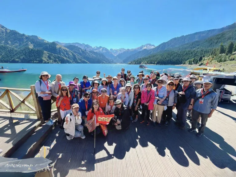 Group of GoGo Tours travelers at Tianshan Tianchi (Heavenly Lake) in Xinjiang, China