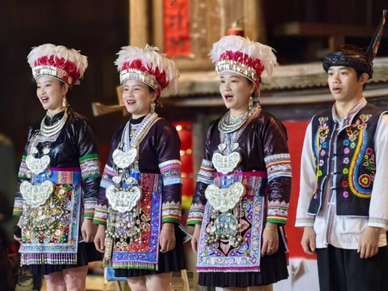 Dong ethnic group performing traditional songs Yunnan Guizhou China tour GoGo Tours