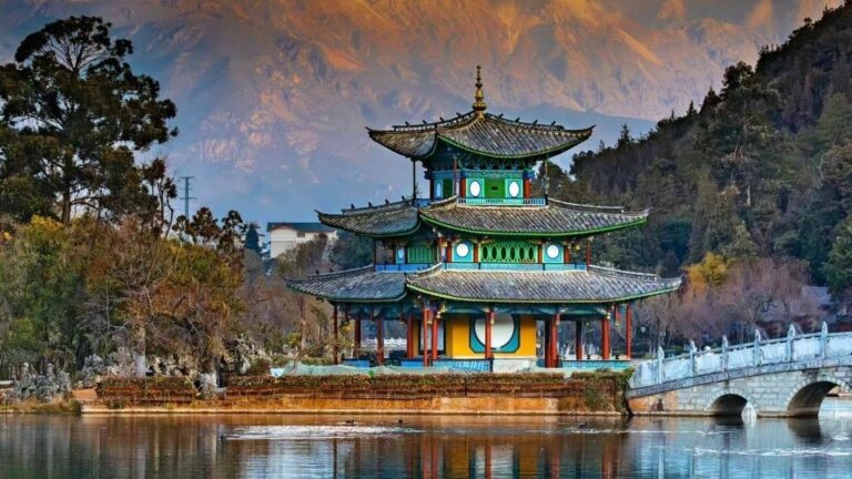 Black Dragon Pool Park with pavilion and Jade Dragon Snow Mountain, Lijiang, Yunnan
