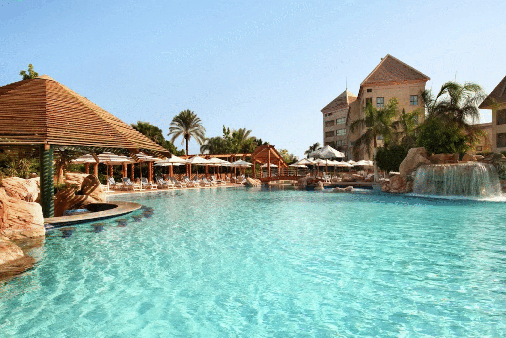 Large outdoor swimming pool at Hilton Pyramids Golf Hotel in Cairo Egypt