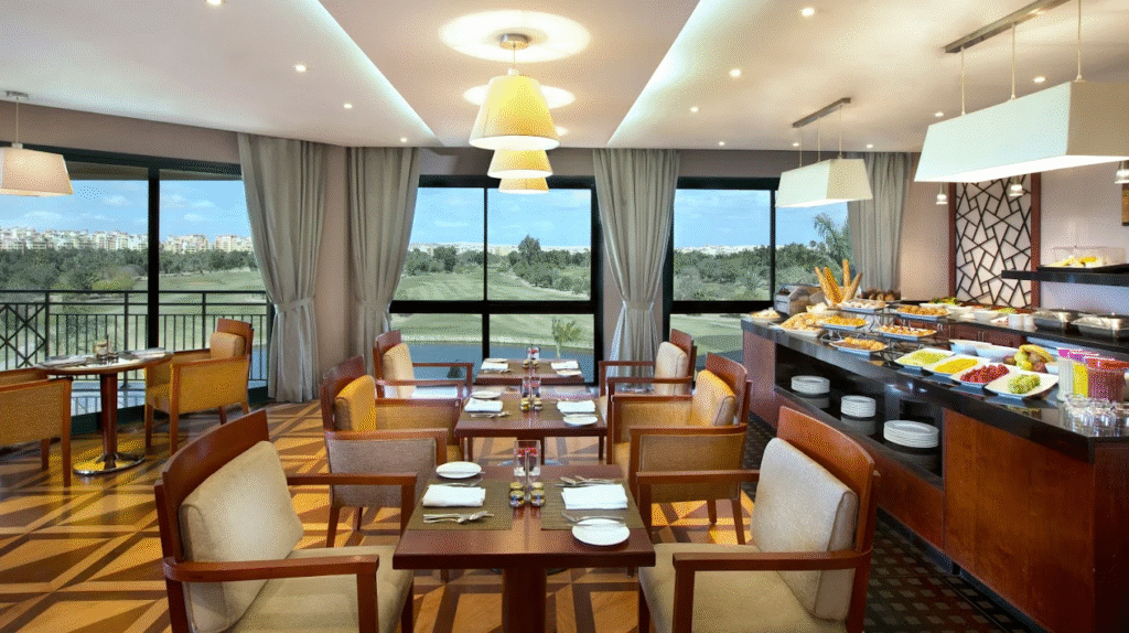 Hilton Pyramids Golf Hotel restaurant interior overlooking golf course in Cairo Egypt