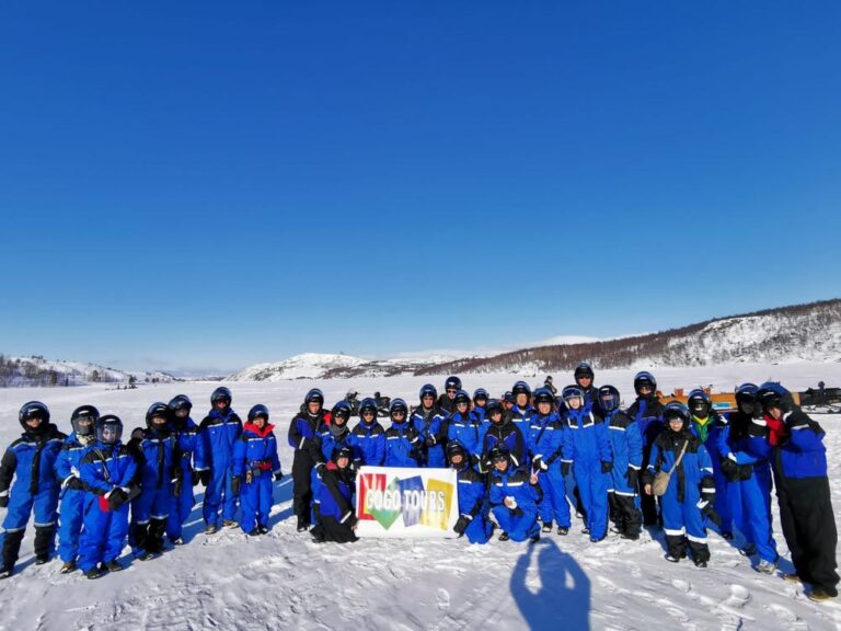 Group of GoGo Tours travelers posing for a photo during the Arctic Circle 9-Day Tour.