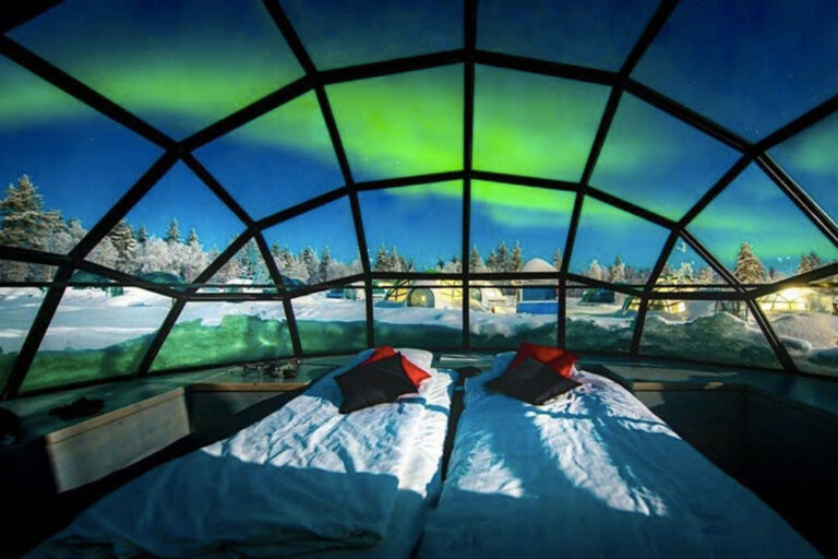 View of the Northern Lights from inside a glass-roof Aurora cabin during GoGo Tours’ Arctic Circle 9-Day Tour.