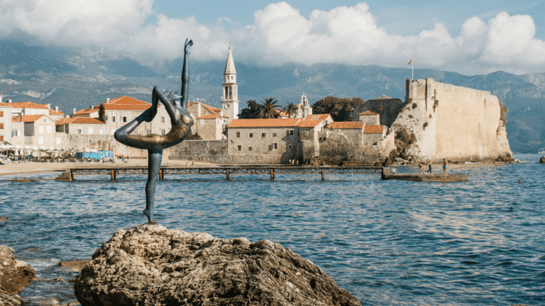 Budva Old Town and Dancer from Budva statue along the Adriatic Sea in Montenegro on Balkan Peninsula 14-Day Tour