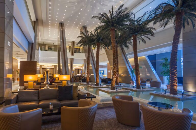 Luxurious lobby of Radisson Blu Hotel in Tunis with palm trees